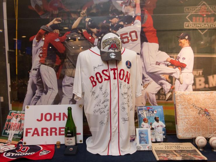 Boston Red Sox uniform and caps memorabilia on a display window