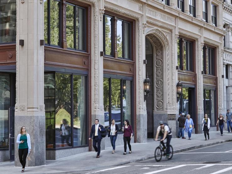 People walking outside of the Little Building in Boston on Boylston Street