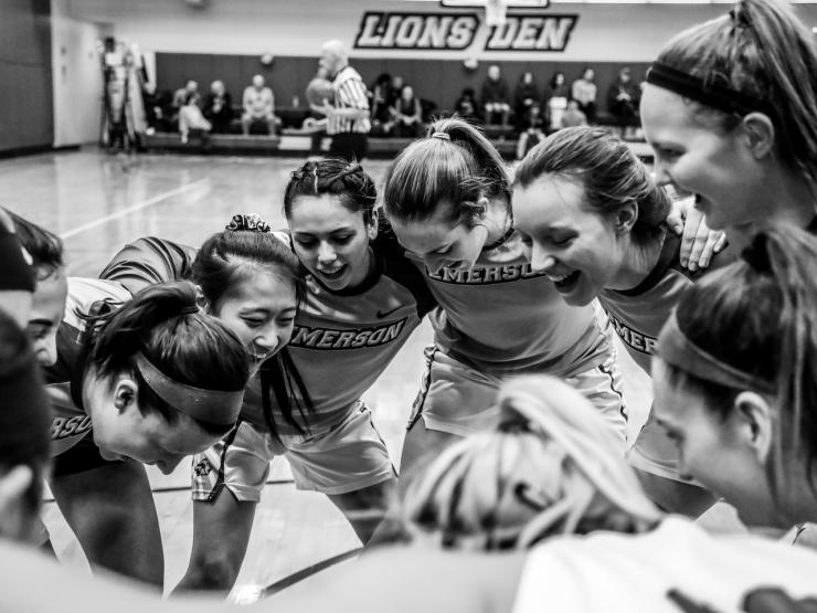 Image of students huddling during a sports game