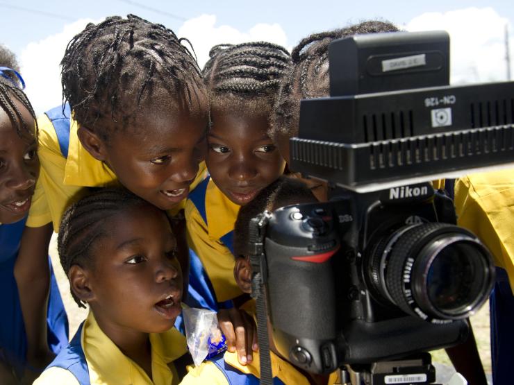 Photo of children looking into camera