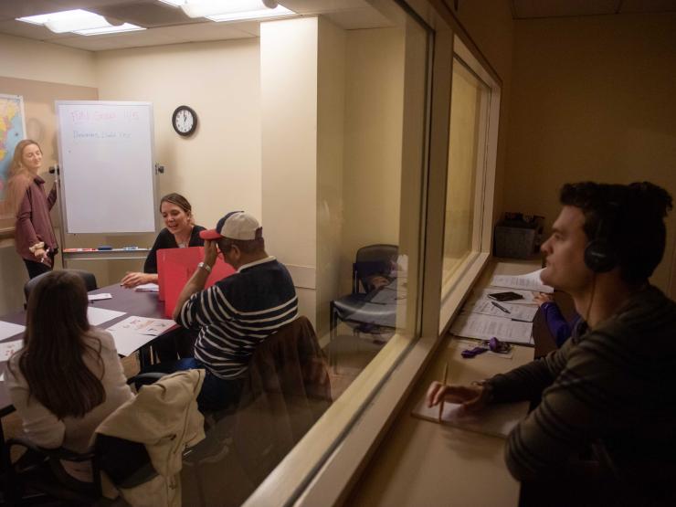 Graduate students observe an adult Aphasia Language group in the Robbins Center