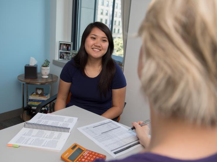 A student meets with their advisor