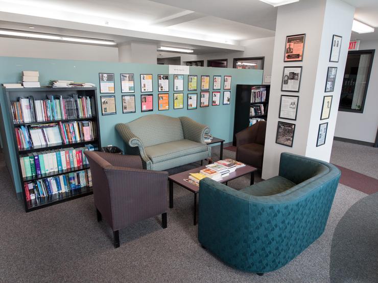 The lounge space in the department of Writing, Literature, and Publishing with chairs and bookshelves