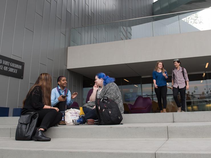 Group of students sitting outside on steps at Emerson Los Angeles