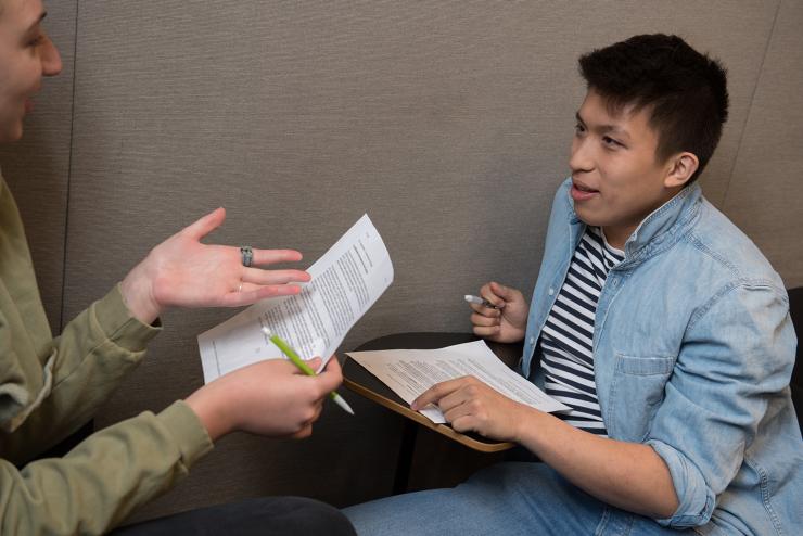 Two students debate in a class