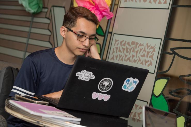 Image of student on a laptop