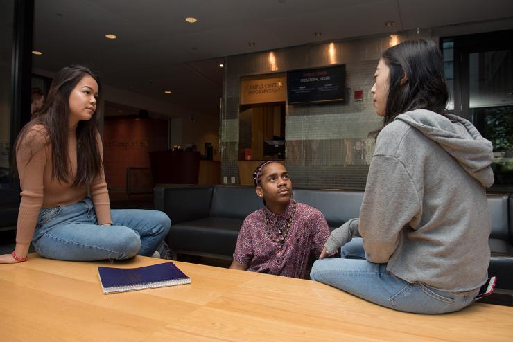 3 students talking