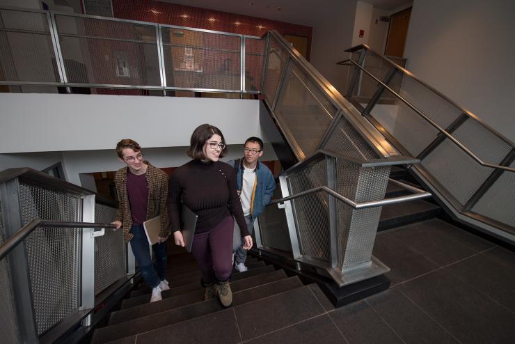 Students walking through piano row