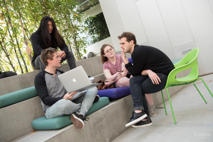 Students sitting and talking outside