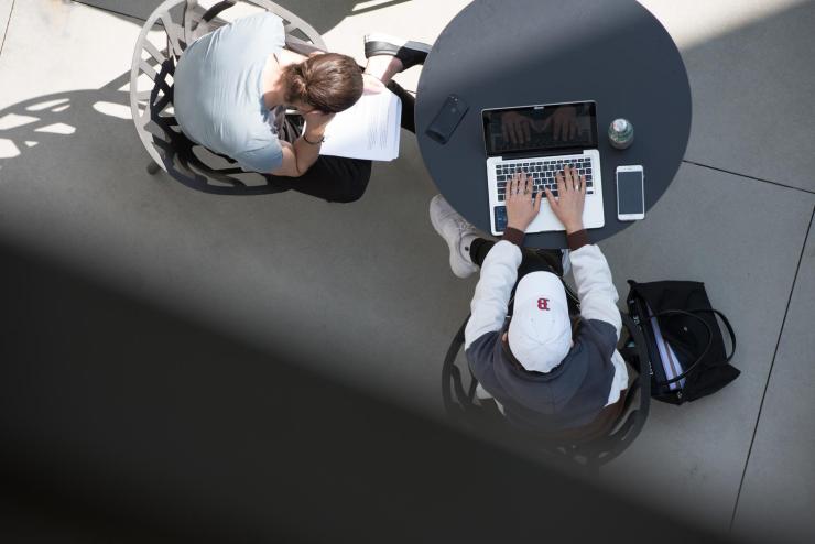 Image of students working on laptop