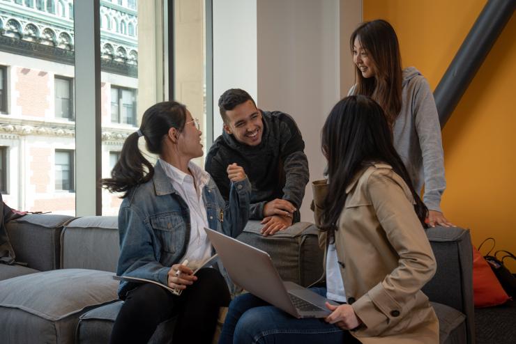 A group of students socializing in a common room