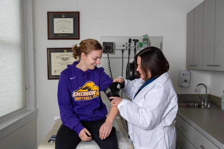 Doctor assessing a student