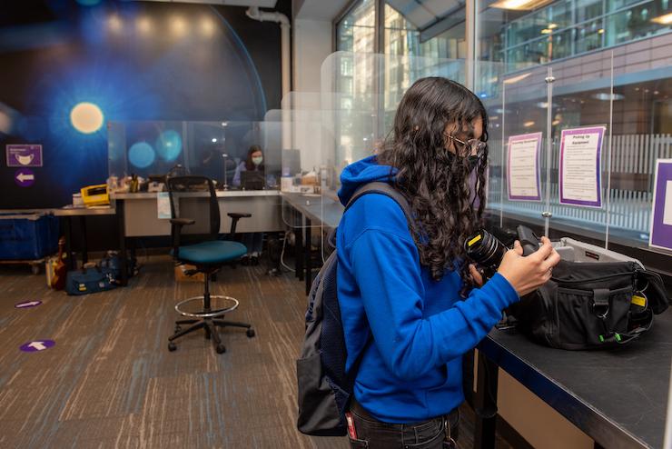 Student working with a camera