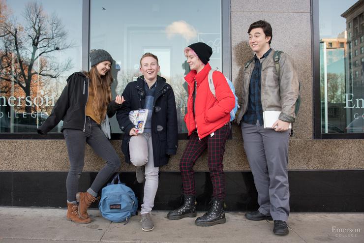 A group of friends hanging outside the Ansin building