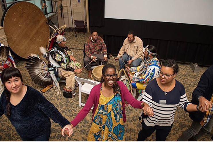 People engaging in a dance during a heritage celebration